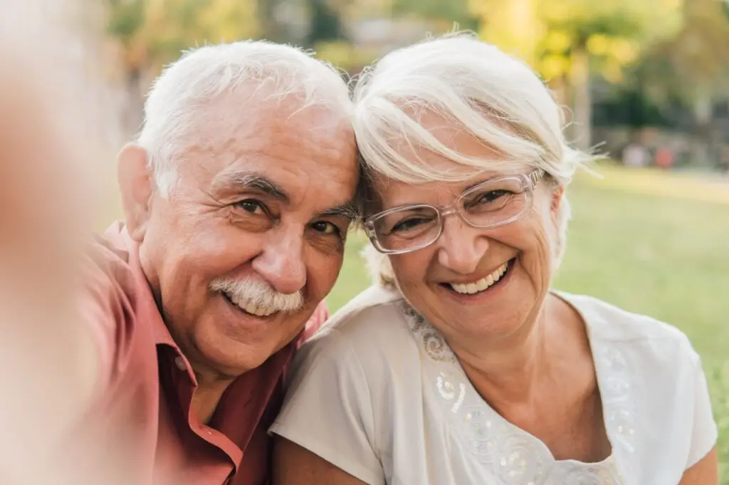 Smiling older couple who are happy with their denture relining