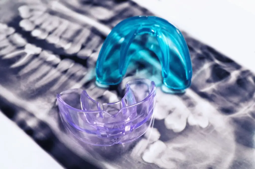 Two dental mouthguards on a dental X-ray at a leading dentures Gold Coast clinic.