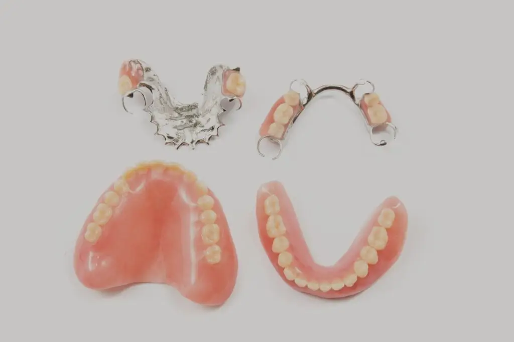 Four types of digital dentures and partial dentures arranged on a white background.